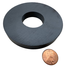 Load image into Gallery viewer, CR337AMAG Ceramic Ring Magnet - 45 Degree Angle View Compared to a Penny