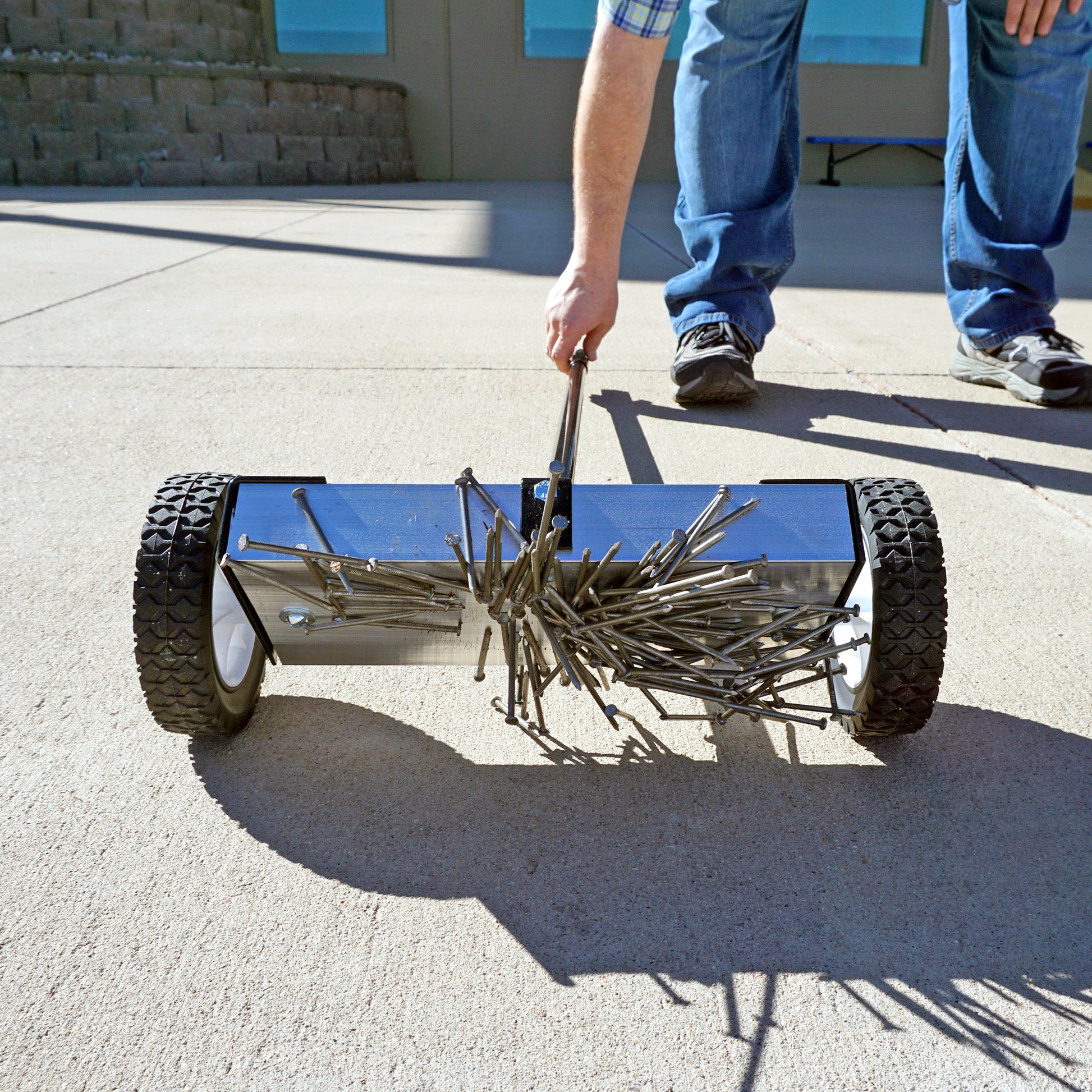 Load image into Gallery viewer, MFSM12 Magnetic Floor Sweeper - Man Sweeping Metal Debris off Sidewalk