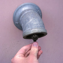 Load image into Gallery viewer, 50696 Magnetic Key, M1-69 Black - Hand Holding Magnetic Key Next to a Drain Pipe