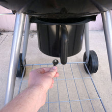 Load image into Gallery viewer, 50696 Magnetic Key, M1-69 Black - Hand Holding Magnetic Key Next to a Barbeque Grill