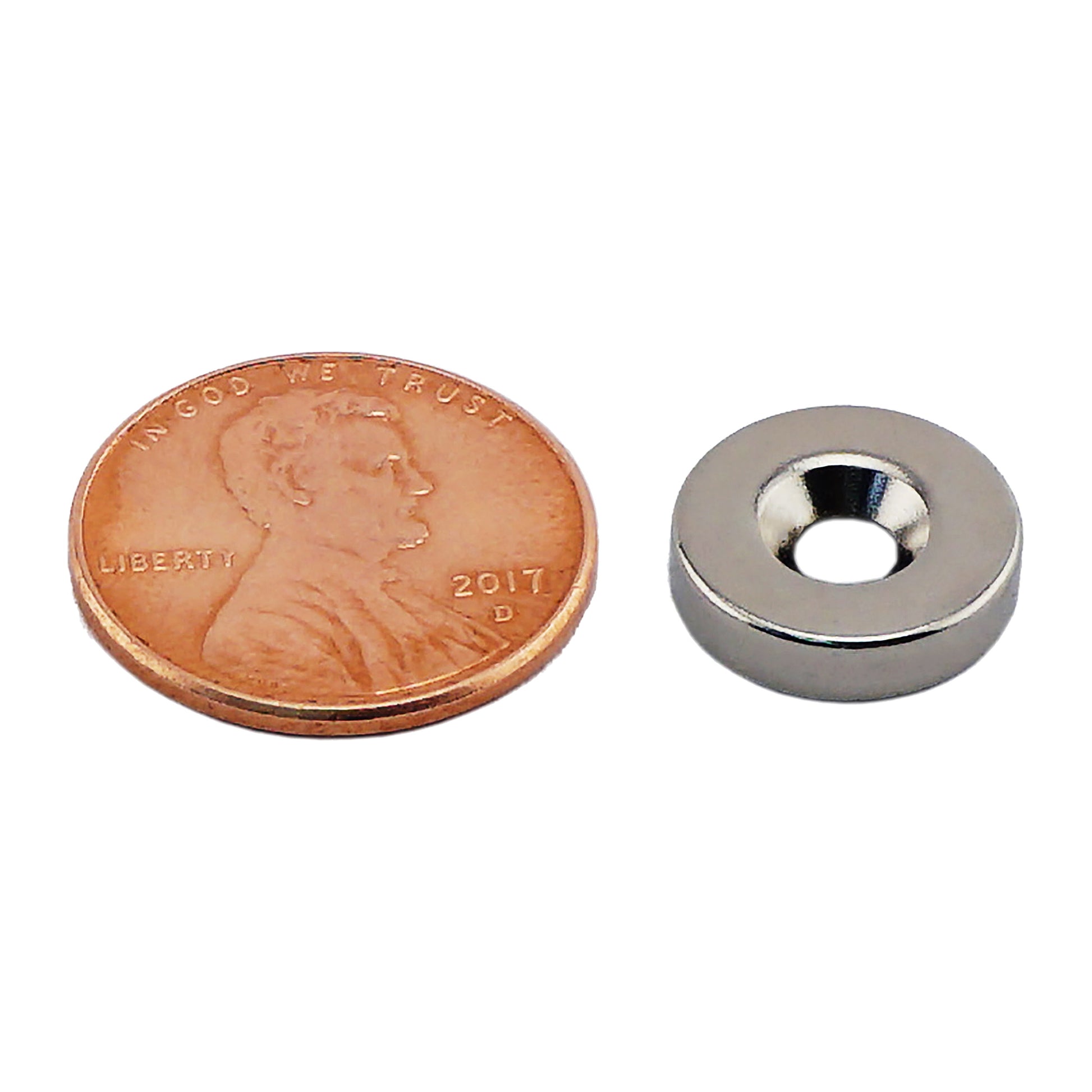 Load image into Gallery viewer, NR007519NCTS Neodymium Countersunk Ring Magnet - Compared to Penny for Size Reference